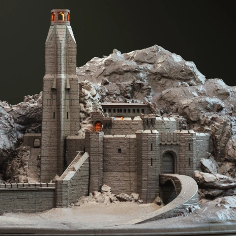 Helm's Deep fortress model with tower, walls, and mountainous backdrop, ready for 3D printing.